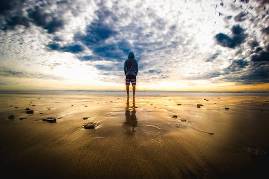 Person Standing on Sand